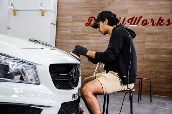 Re-coating a newly repainted bumper for a returning custo...